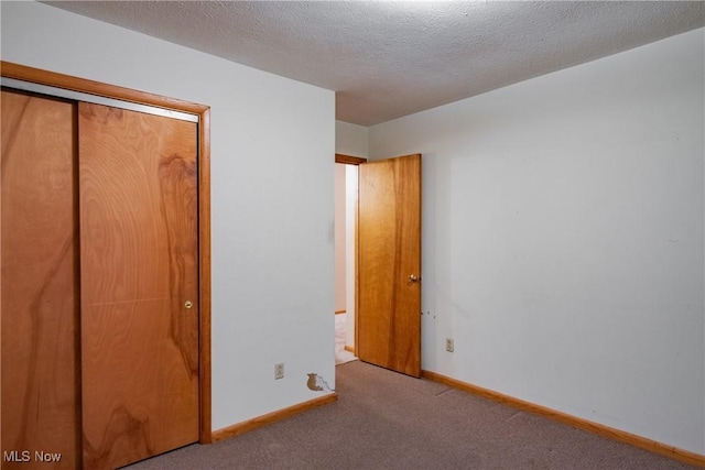 2691 State Route 339, Belpre, OH 45714 - unfurnished bedroom with carpet, a closet, and a textured ceiling