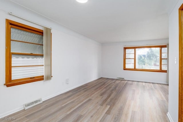 426 E 200th St, Euclid, OH 44119 - empty room with wood finished floors and baseboards