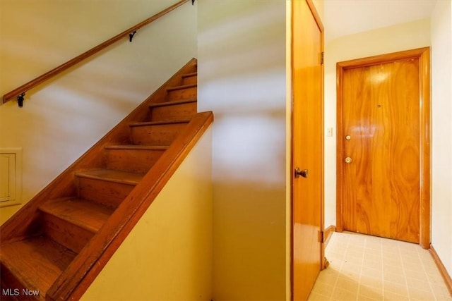 426 E 200th St, Euclid, OH 44119 - stairway featuring baseboards and tile patterned floors