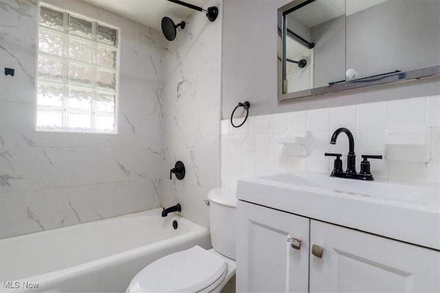 426 E 200th St, Euclid, OH 44119 - full bath featuring vanity, tile walls,  shower combination, and plenty of natural light