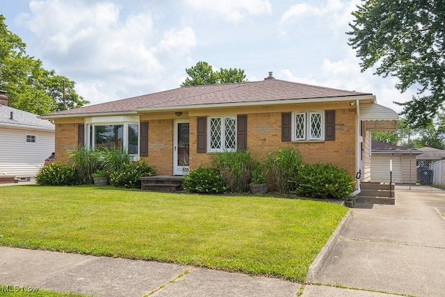 505 Lansing Rd, Akron, OH 44312 - view of front of property with brick siding, a front yard, and concrete driveway