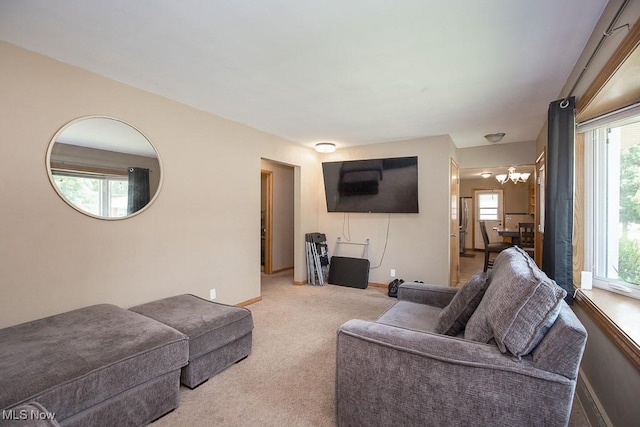 505 Lansing Rd, Akron, OH 44312 - living area with a chandelier and light colored carpet