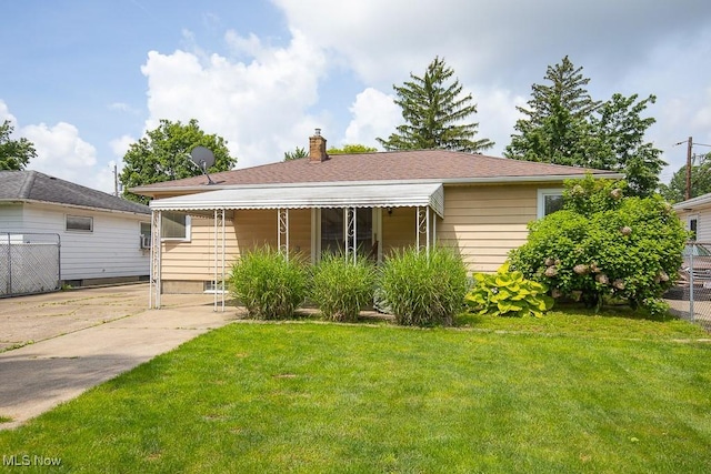 505 Lansing Rd, Akron, OH 44312 - bungalow-style home with a front lawn and a chimney