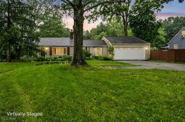 8743 Usher Rd, Olmsted Twp, OH 44138 - single story home with driveway, a chimney, and a garage