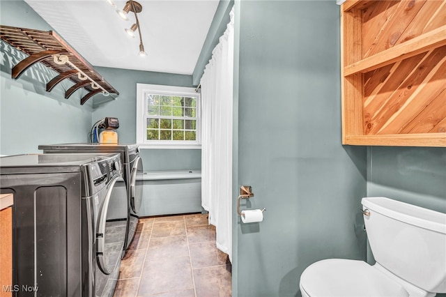 8743 Usher Rd, Olmsted Twp, OH 44138 - laundry room with washer and dryer and tile patterned floors