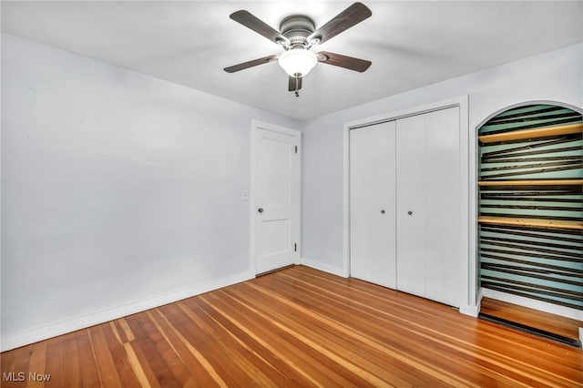 8743 Usher Rd, Olmsted Twp, OH 44138 - unfurnished bedroom with wood finished floors, a ceiling fan, and a closet