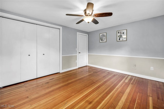 8743 Usher Rd, Olmsted Twp, OH 44138 - unfurnished bedroom with a closet, wood-type flooring, and a ceiling fan