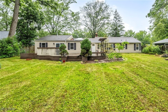 8743 Usher Rd, Olmsted Twp, OH 44138 - rear view of house with a wooden deck, a yard, and a chimney