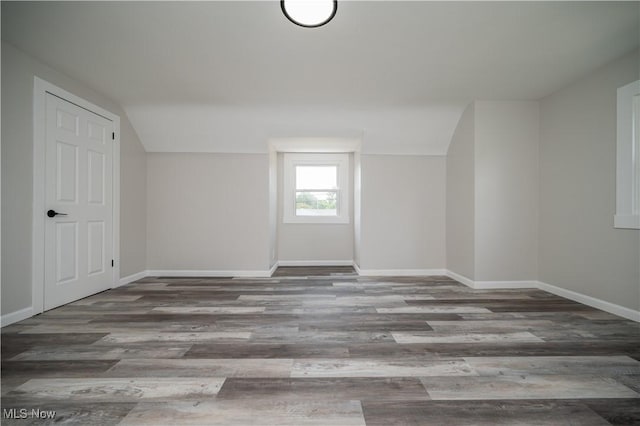 595 Elm St, Struthers, OH 44471 - bonus room featuring wood finished floors and vaulted ceiling