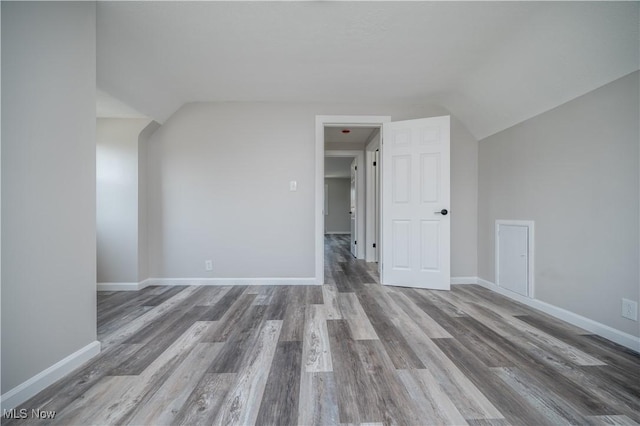 595 Elm St, Struthers, OH 44471 - additional living space with wood finished floors and vaulted ceiling