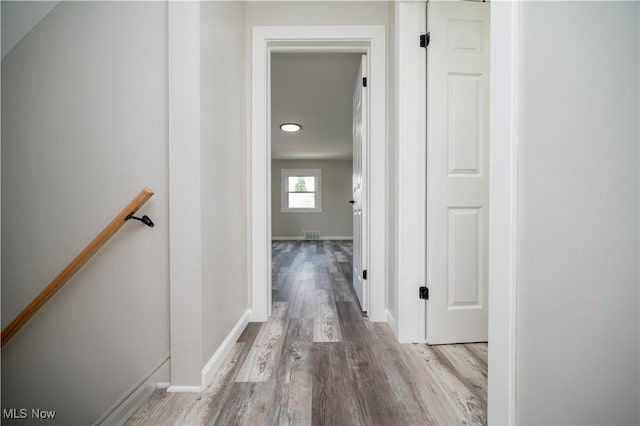 595 Elm St, Struthers, OH 44471 - corridor with wood finished floors and an upstairs landing