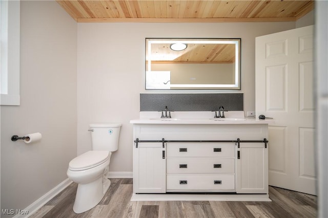 595 Elm St, Struthers, OH 44471 - bathroom with wooden ceiling, double vanity, wood finished floors, tasteful backsplash, and crown molding