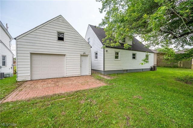 595 Elm St, Struthers, OH 44471 - rear view of house with a garage and an outbuilding