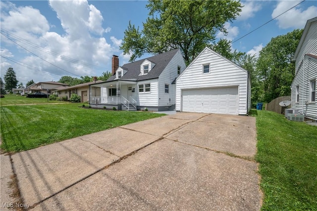 595 Elm St, Struthers, OH 44471 - cape cod-style house with a porch, a garage, an outdoor structure, a front lawn, and a chimney