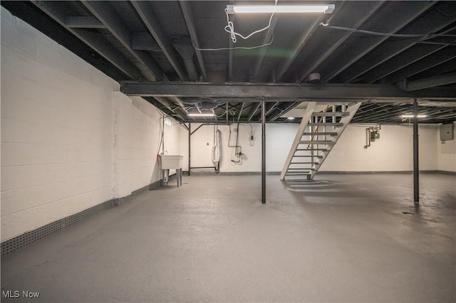 595 Elm St, Struthers, OH 44471 - unfinished basement with stairway, electric panel, and concrete block wall