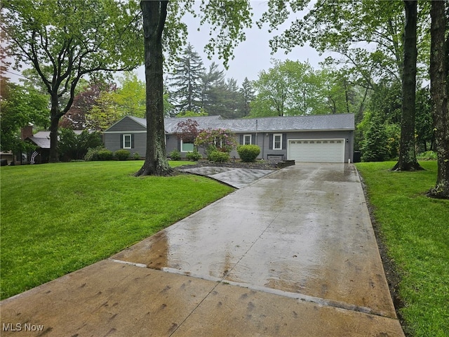 7975 Richard Rd, Broadview Heights, OH 44147 - ranch-style home featuring an attached garage, driveway, and a front lawn