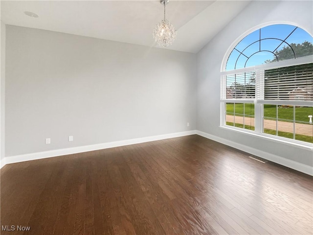 3217 Deborah Ct, Uniontown, OH 44685 - empty room featuring a chandelier, dark wood finished floors, and lofted ceiling