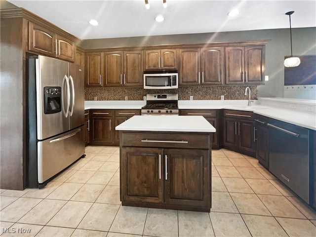 3217 Deborah Ct, Uniontown, OH 44685 - kitchen with stainless steel appliances, light countertops, decorative backsplash, light tile patterned flooring, and hanging light fixtures