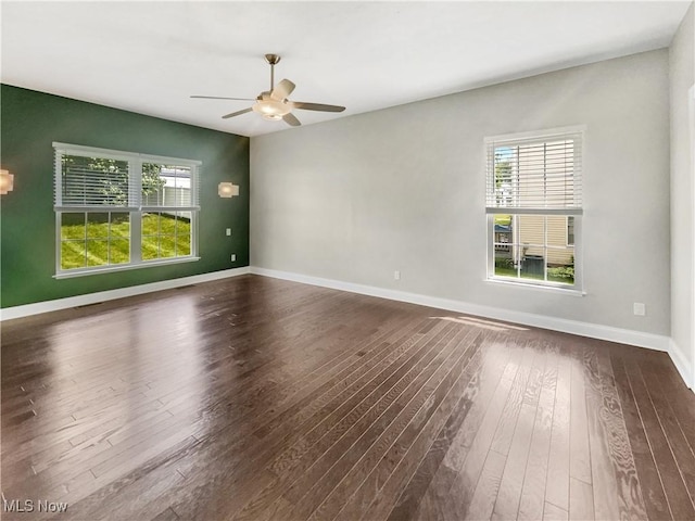 3217 Deborah Ct, Uniontown, OH 44685 - unfurnished room with healthy amount of natural light, a ceiling fan, and dark wood-style floors