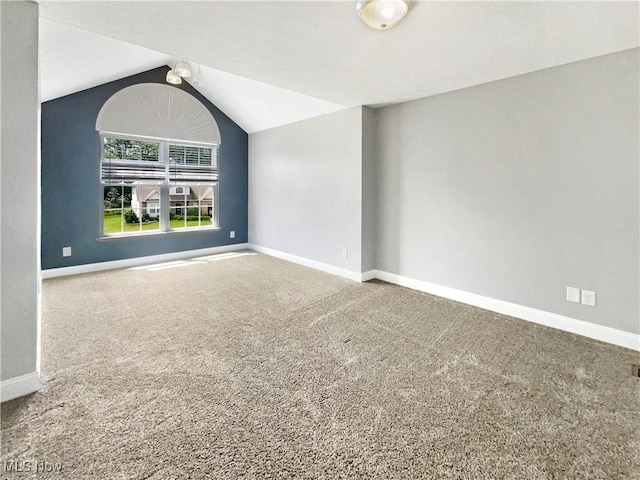 3217 Deborah Ct, Uniontown, OH 44685 - carpeted empty room with baseboards and lofted ceiling