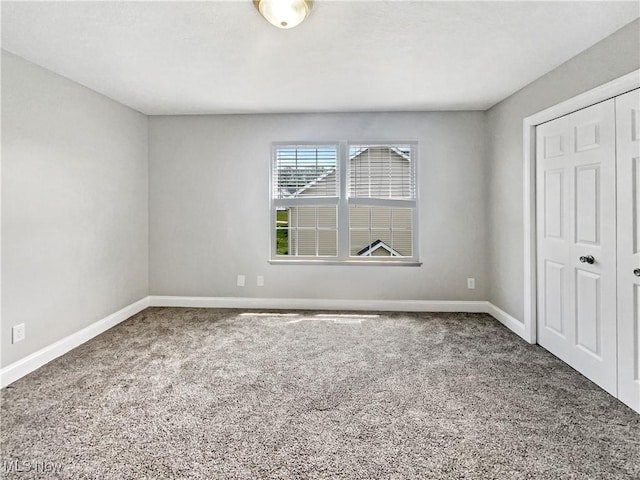 3217 Deborah Ct, Uniontown, OH 44685 - unfurnished bedroom featuring carpet floors and a closet