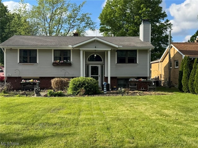 20684 Albion Rd, Strongsville, OH 44149 - bi-level home featuring a front yard, a chimney, and roof with shingles