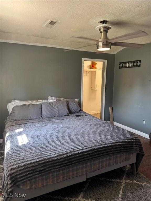 20684 Albion Rd, Strongsville, OH 44149 - bedroom featuring a textured ceiling, ceiling fan, and wood finished floors