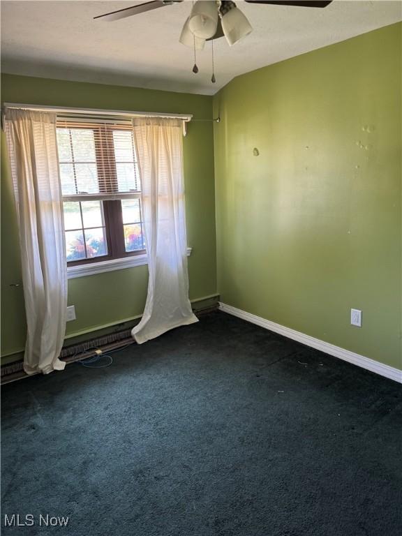 20684 Albion Rd, Strongsville, OH 44149 - unfurnished room with a ceiling fan and dark carpet