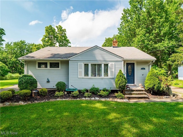 110 Sprague Rd, Berea, OH 44107 - view of front of home featuring a chimney, a front lawn, and a shingled roof