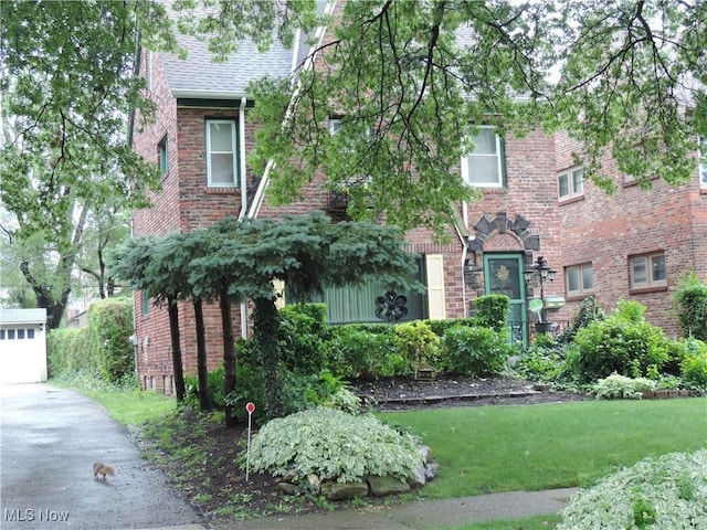 2323 Scholl Rd, University Heights, OH 44118 - view of front of house with brick siding and asphalt driveway
