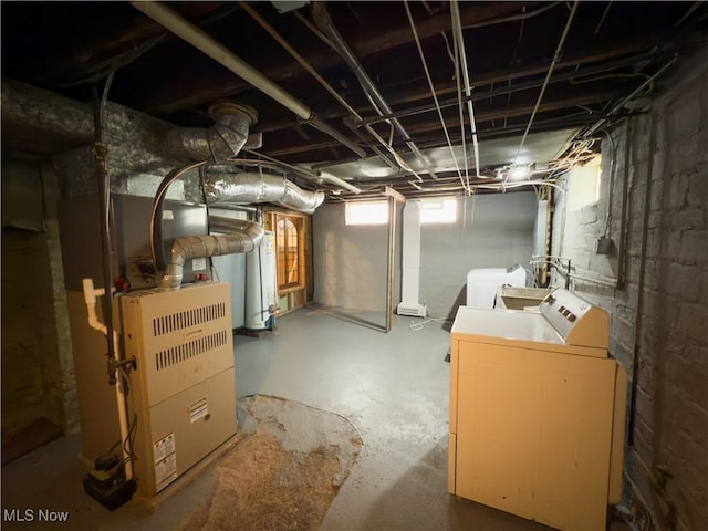 2323 Scholl Rd, University Heights, OH 44118 - below grade area featuring washer and dryer, gas water heater, and heating unit