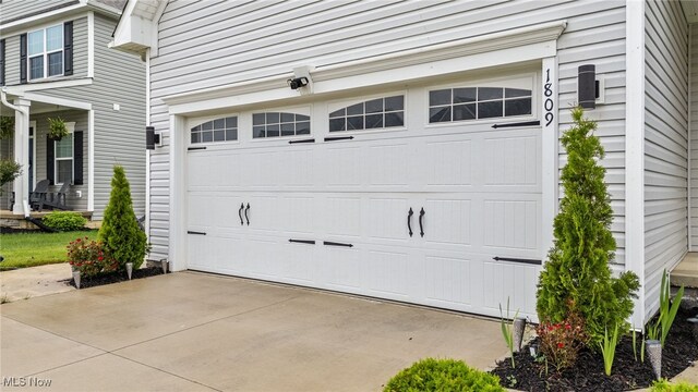 1809 Muirfield Ln, Painesville, OH 44077 - garage featuring concrete driveway