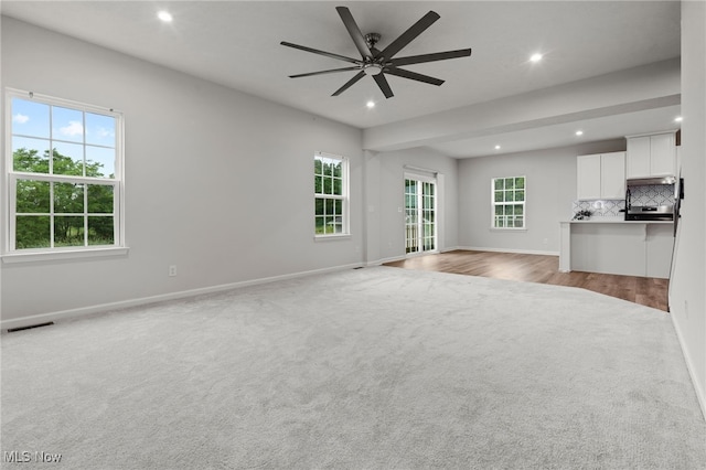 1809 Muirfield Ln, Painesville, OH 44077 - unfurnished living room featuring light carpet, recessed lighting, and a ceiling fan