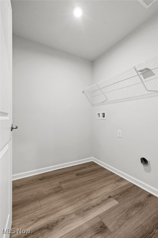 1809 Muirfield Ln, Painesville, OH 44077 - laundry room with hookup for a washing machine, wood finished floors, and recessed lighting