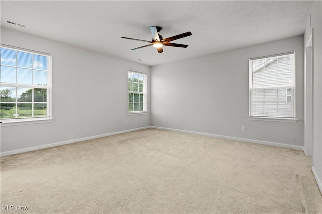1809 Muirfield Ln, Painesville, OH 44077 - carpeted spare room with baseboards and a ceiling fan