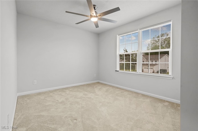 1809 Muirfield Ln, Painesville, OH 44077 - empty room with carpet and a ceiling fan