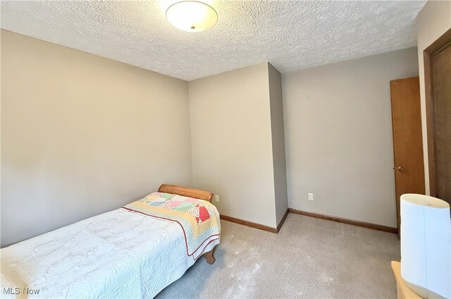 4901 Kings Creek Rd, Weirton, WV 26062 - carpeted bedroom with a textured ceiling