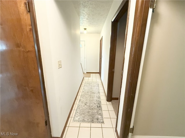 4901 Kings Creek Rd, Weirton, WV 26062 - corridor with a textured ceiling and light tile patterned flooring