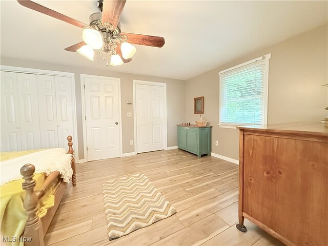 4901 Kings Creek Rd, Weirton, WV 26062 - unfurnished bedroom featuring light wood-type flooring, multiple closets, and ceiling fan