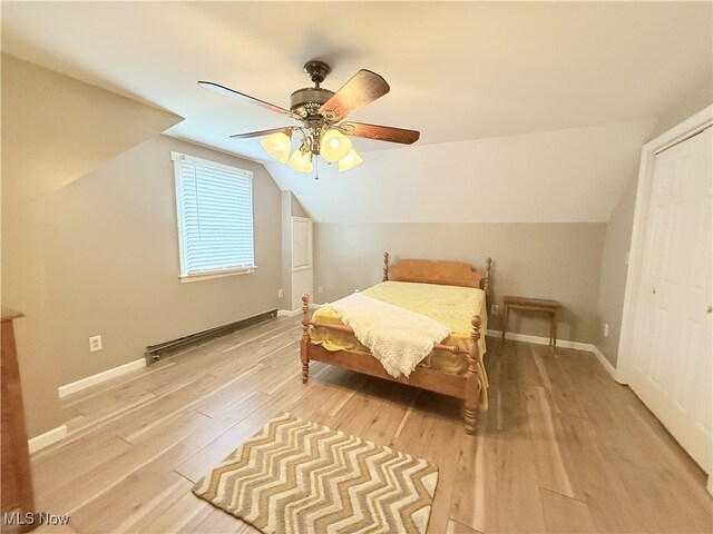 4901 Kings Creek Rd, Weirton, WV 26062 - bedroom featuring light wood-style flooring, lofted ceiling, a ceiling fan, and a closet