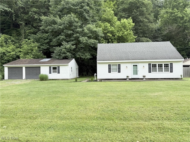 4901 Kings Creek Rd, Weirton, WV 26062 - view of front facade featuring a detached garage, an outbuilding, a front yard, and a shingled roof