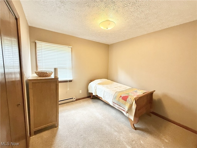 4901 Kings Creek Rd, Weirton, WV 26062 - bedroom with baseboard heating, carpet flooring, a closet, and a textured ceiling