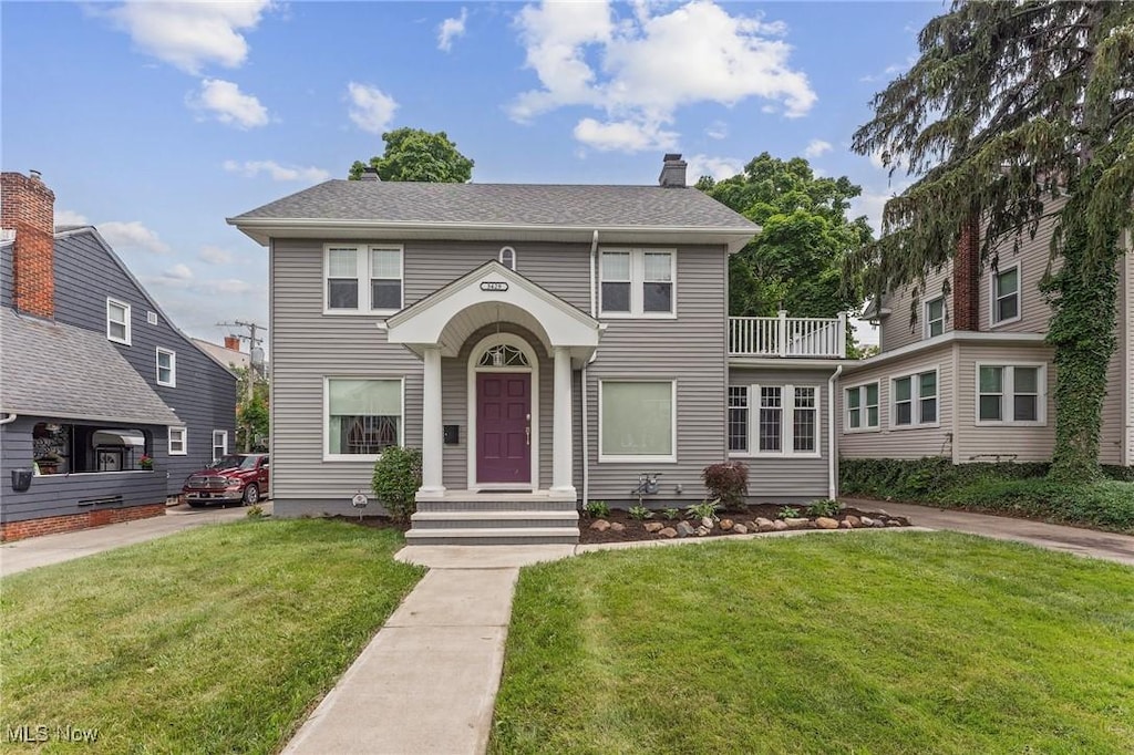 3429 Milverton Rd, Shaker Heights, OH 44120 - traditional home with a front yard, a chimney, and a balcony