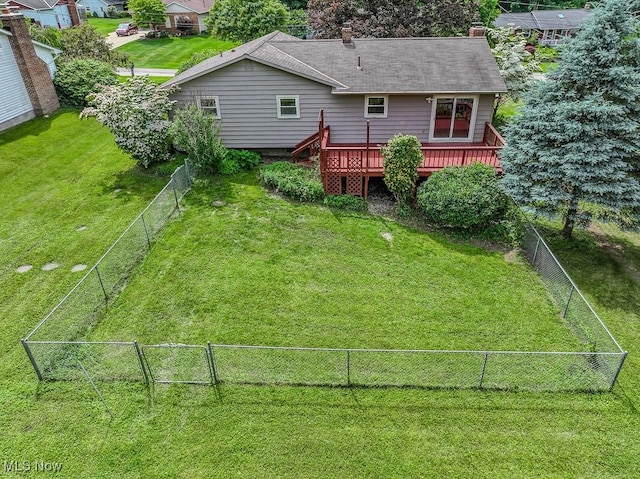 4671 Milford Dr, Perry, OH 44081 - back of property with a deck, a fenced backyard, and a chimney