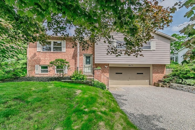 4671 Milford Dr, Perry, OH 44081 - raised ranch with a garage, driveway, a front lawn, and brick siding