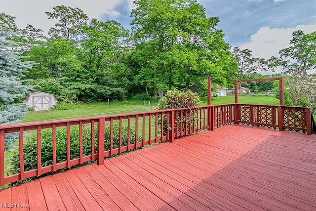 4671 Milford Dr, Perry, OH 44081 - wooden terrace featuring a storage shed, a lawn, and view of scattered trees