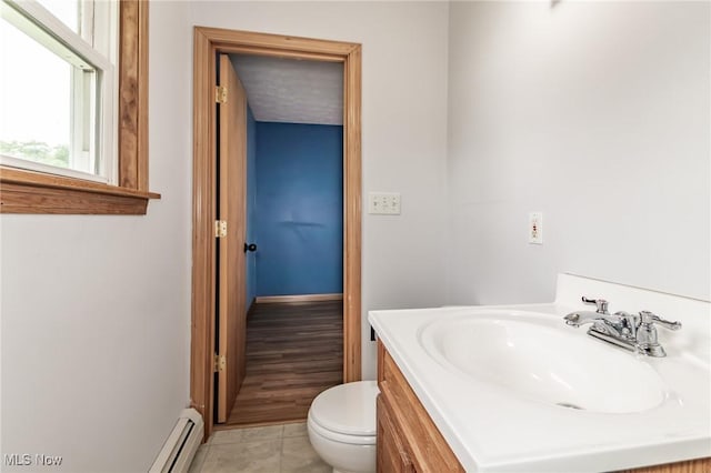 4671 Milford Dr, Perry, OH 44081 - bathroom with vanity, tile patterned flooring, and a baseboard heating unit