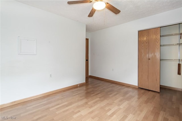 4671 Milford Dr, Perry, OH 44081 - unfurnished bedroom featuring light wood finished floors, a closet, and a ceiling fan