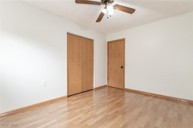 4671 Milford Dr, Perry, OH 44081 - unfurnished bedroom with light wood finished floors, a closet, and ceiling fan