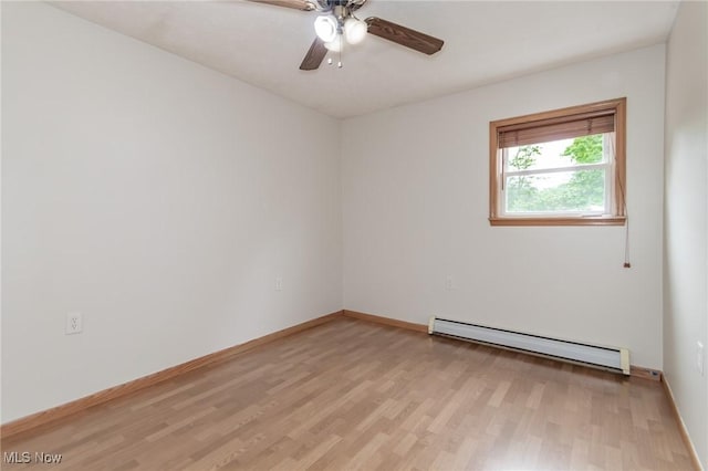 4671 Milford Dr, Perry, OH 44081 - empty room featuring a baseboard radiator, light wood-style flooring, and a ceiling fan